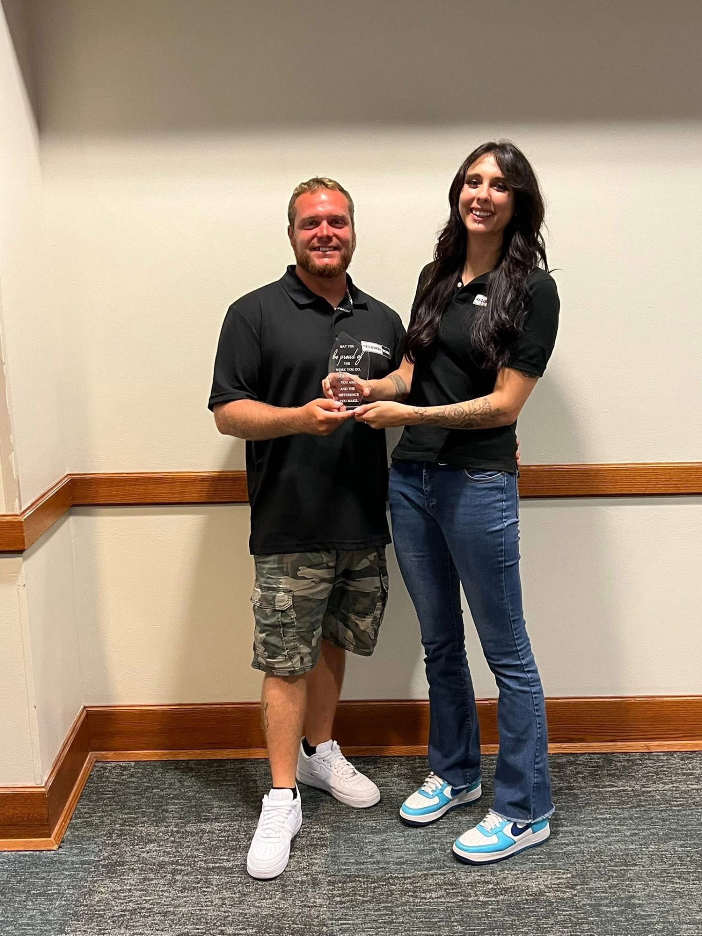 Recovery Worx team members holding a recognition award
